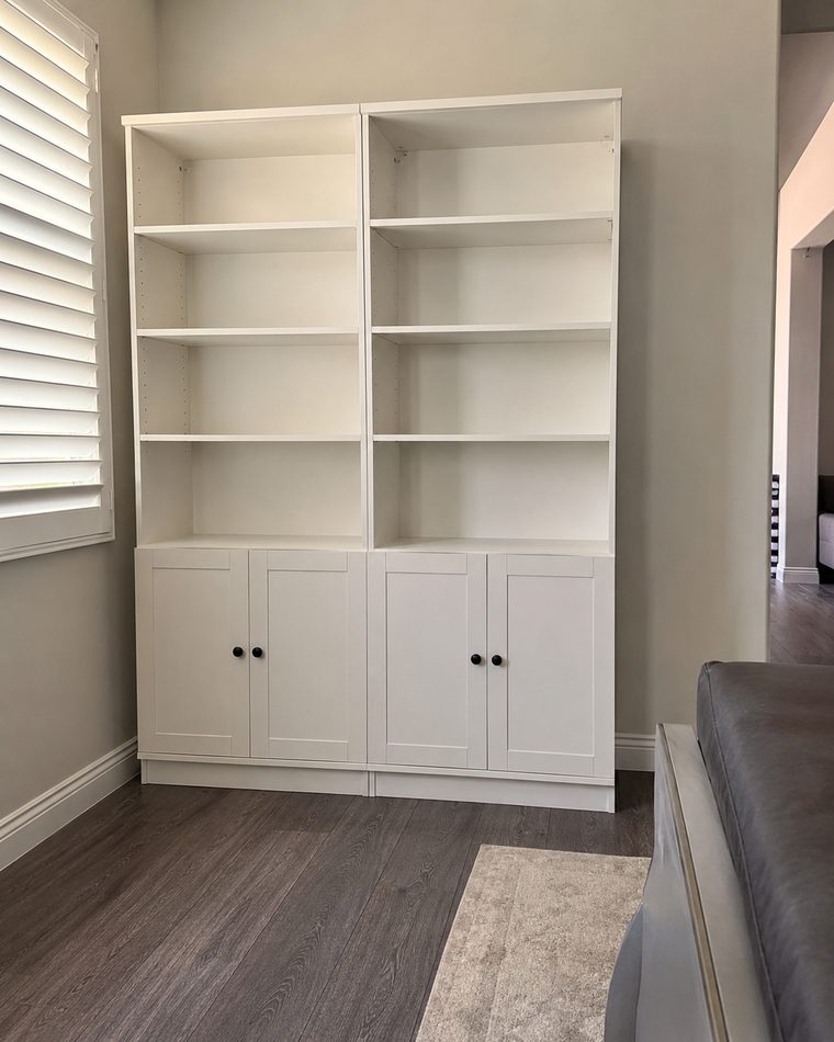 White built-in bookcases with shaker cabinet bases